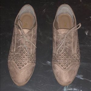 Tan flats with holes in toes